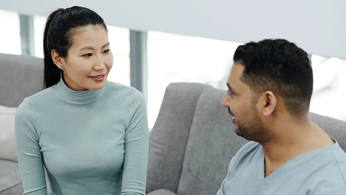 Clinician and patient talking during communication support after aphasia